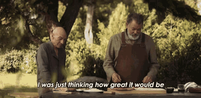 two men sitting at a table with the words " i was just thinking how great it would be " above them