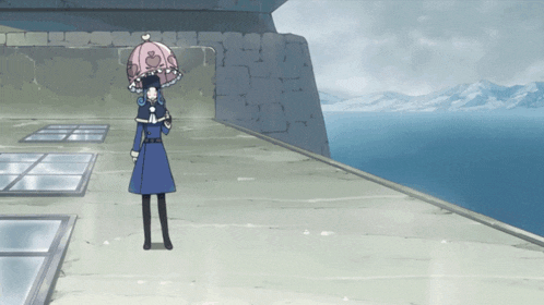 a woman in a blue coat is holding a pink umbrella in front of a body of water