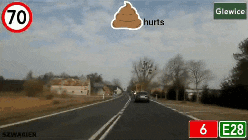 a road with a sign that says e28 and a sign that says hurts