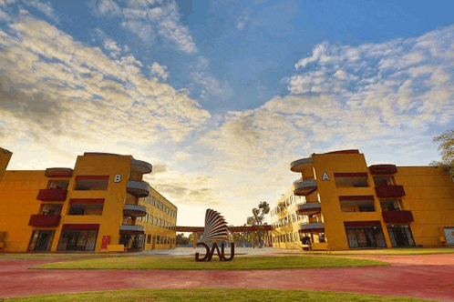 a large yellow building with the letters b and a on the front