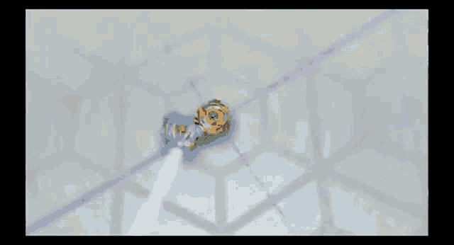 two spinning tops are fighting each other in a video game and one of them is spinning faster than the other .