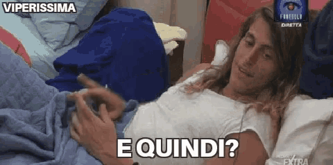 a woman is laying on a bed with the words " e quindi " on the bottom