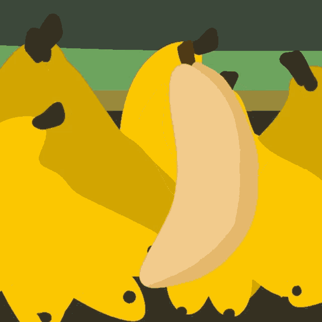 a bunch of bananas on a table with one being cut in half