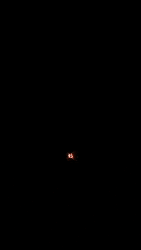 a red lightning bolt strikes in the dark