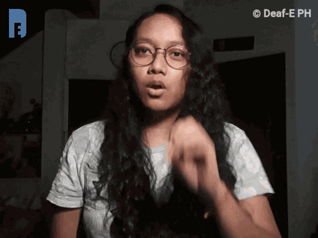a woman wearing glasses and a white shirt says deaf-eph in the corner