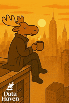 a moose is sitting on a ledge holding a cup of coffee in front of a city skyline