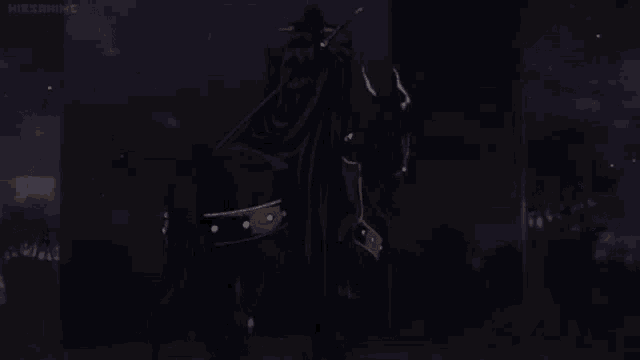 a man is riding on the back of a black horse .