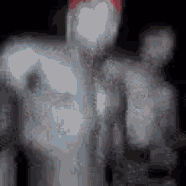 a blurred image of a man with a red head