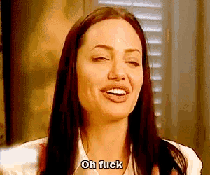 a woman with long hair is making a funny face and says `` oh fuck '' .