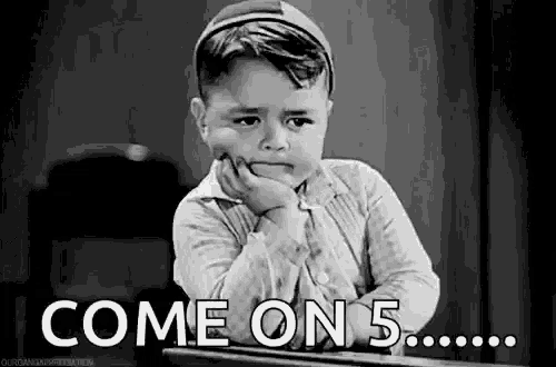 a black and white photo of a little boy sitting at a desk with his hand on his chin and the words `` come on 5 '' .