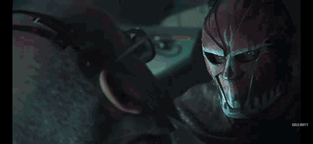 a close up of a red mask with call of duty written on the bottom right