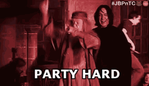 a couple of people standing next to each other in a dark room with the words `` party hard '' written on the bottom .