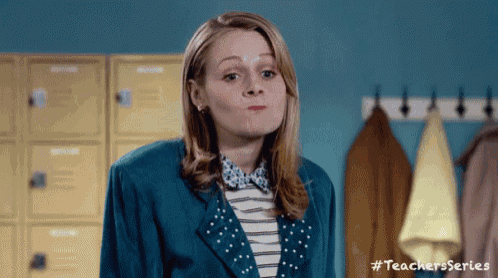 a woman in a blue jacket is making a funny face in front of lockers with #teachersseries written on the bottom