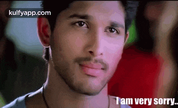 a close up of a man 's face with a caption that says `` i am very sorry '' .