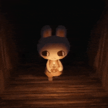 a cartoon bunny holding a candle in a dark room