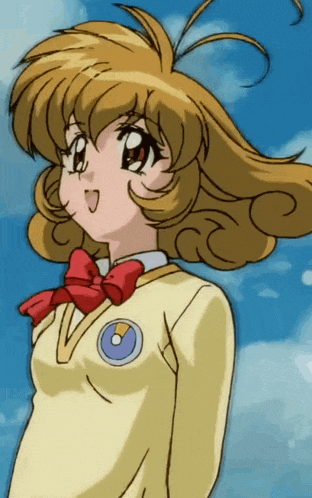 a girl in a yellow uniform with a red bow
