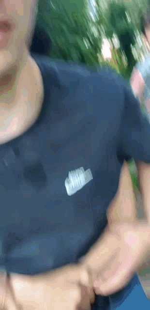 a person wearing a black shirt with a nike logo on the front