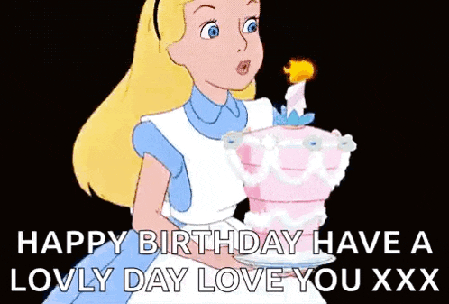 alice from alice in wonderland is blowing out a candle on a pink birthday cake .