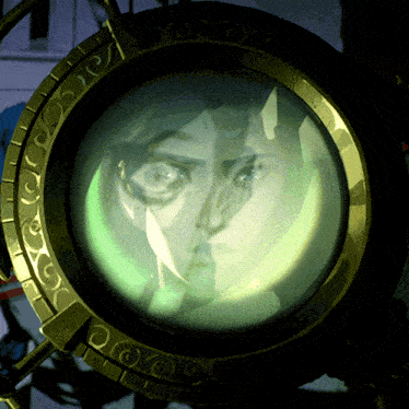 a picture of a man 's face is projected onto a gold object