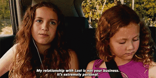 two young girls are sitting in the back seat of a car talking about their relationship with lost