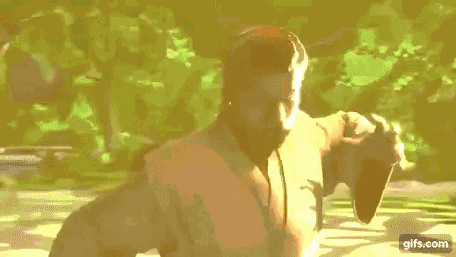a man is holding his hand out in front of his face in a video game .