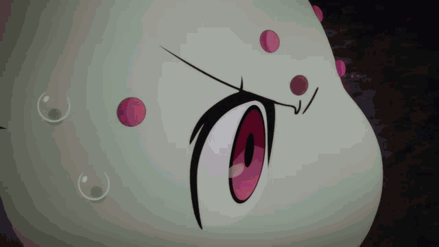 a close up of a cartoon character 's face with red eyes