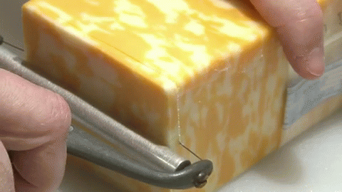In Case You Weren'T Aware Of How A Cheese Slicer Worked. GIF - Cheese Slice Cheddar GIFs