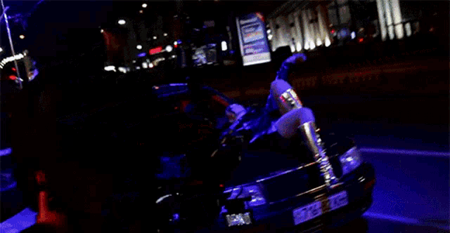 a black car with a license plate that says 716-82-2kh
