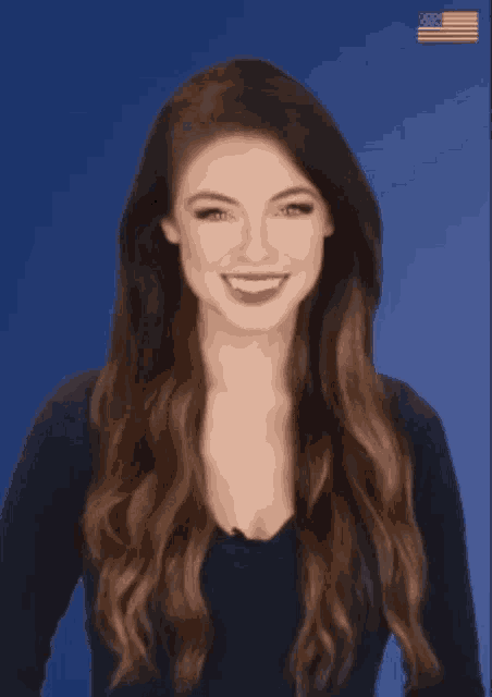 a woman with long brown hair is smiling with her eyes closed in front of an american flag