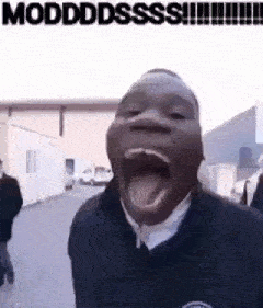 a man is making a funny face with his mouth open and his tongue out .