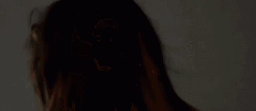 a close up of a person 's face with their mouth open .
