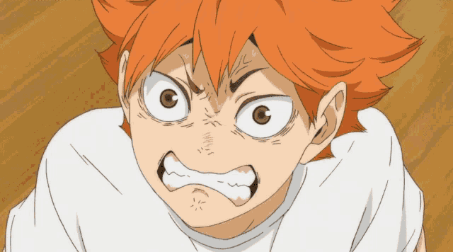 a close up of a person 's face with orange hair and brown eyes