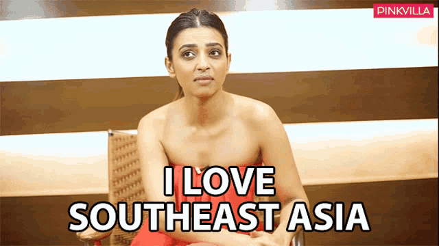 a woman is sitting in a chair with the words i love southeast asia on the bottom