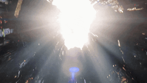 a bright light is shining through a dark background