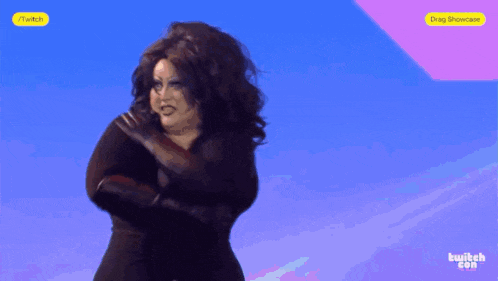 a woman in a black dress is dancing in front of a blue background that says twitch on it