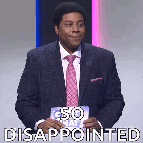 a man in a suit and tie holding a sign that says disappointed