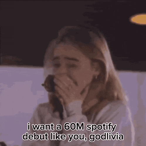a woman is crying and saying i want a 60m spotify debut like you godolivia