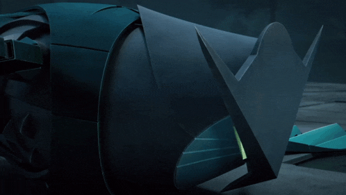 a black object with a green arrow pointing to the right