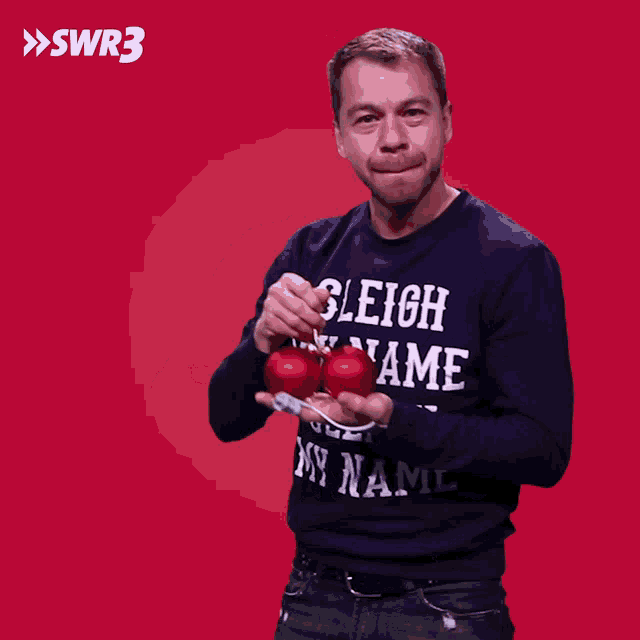 a man wearing a sweater that says sleigh name