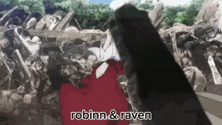 robinn and raven are standing next to each other in front of a pile of rocks .