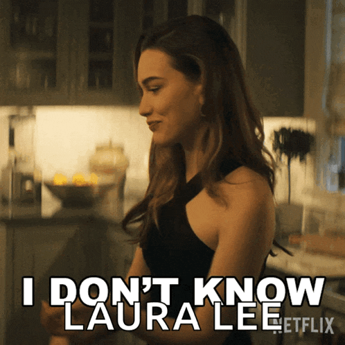 a woman says " i don 't know laura lee " while standing in a kitchen