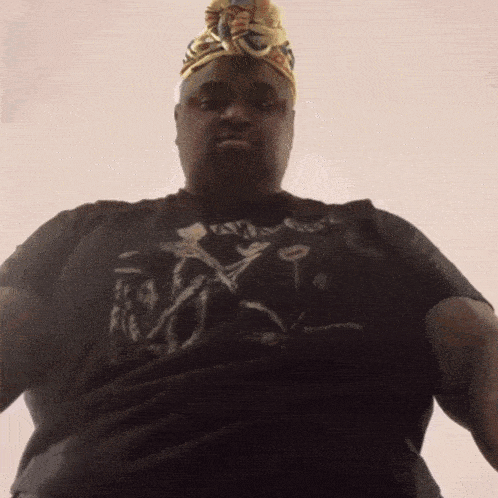 a man wearing a turban and a t-shirt that says ' i love you ' on it