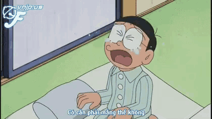 a cartoon character is sitting on a bed with a pillow and says minh moi ve khuya mot chut thoi ma