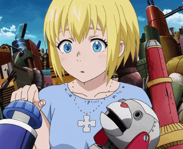 a girl with blonde hair and blue eyes is holding a toy robot