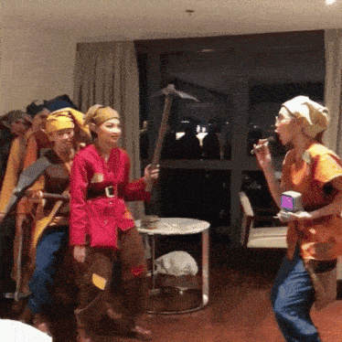a group of people dressed up in costumes are playing a game