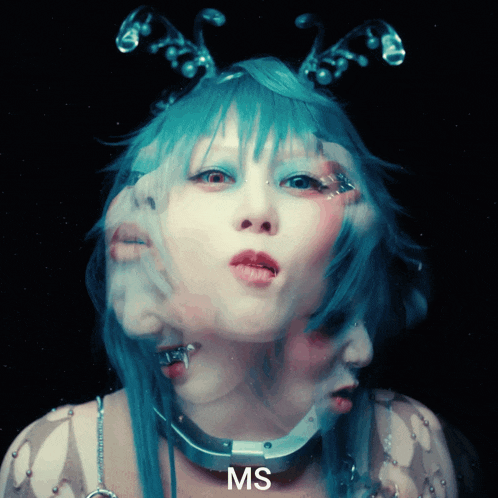a close up of a woman 's face with the letters ms on the bottom
