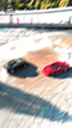 two cars are racing on a track with a sign that says win tik tok