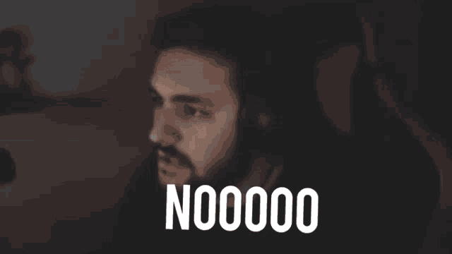 a man wearing headphones says " nooooo " in front of him