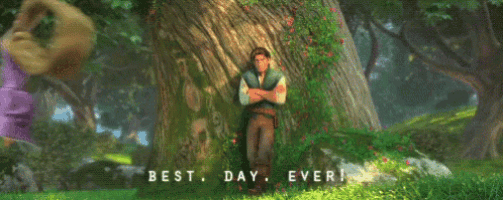a man and a woman are leaning against a tree in a forest with the words `` best day ever '' above them .