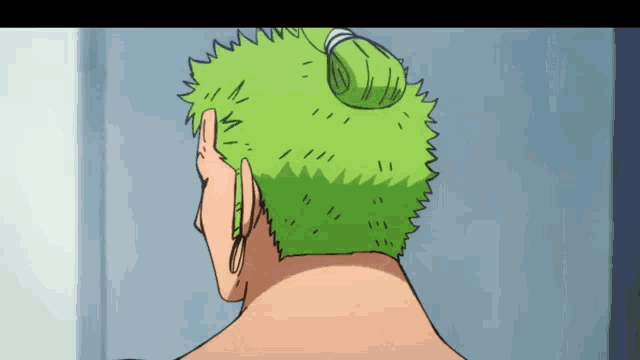 a close up of a person 's green hair